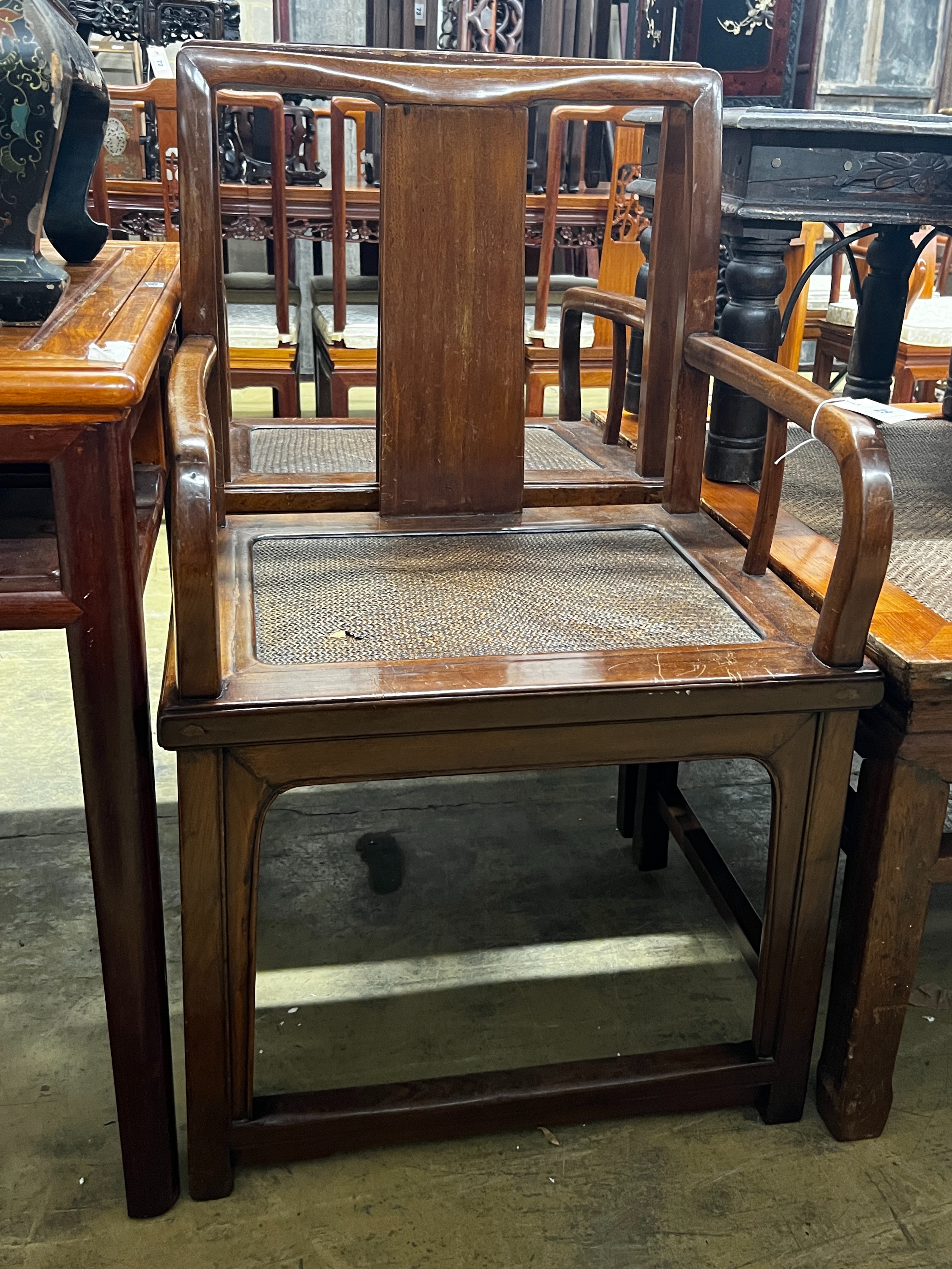 A pair of Chinese caned hardwood elbow chairs, width 55cm, depth 44cm, height 97cm